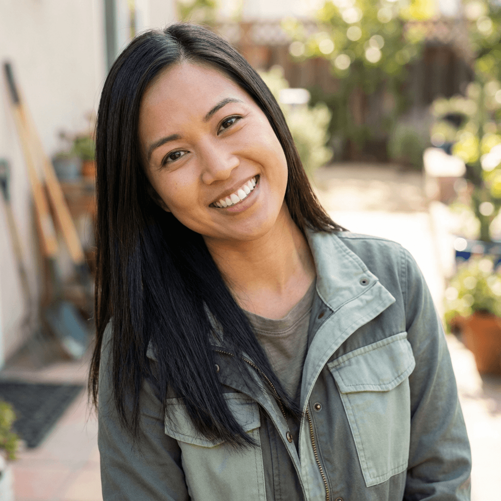 Female operations coordinator in her early 30s, East Asian, professional and approachable for facilities coordination
